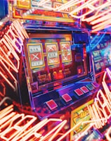 A vibrant scene featuring a classic slot machine with bright neon lights surrounding it. The slot machine displays symbols like 'Bar' and '7' and is set in a lively arcade environment. Reflections and colorful lighting add a sense of excitement and motion.